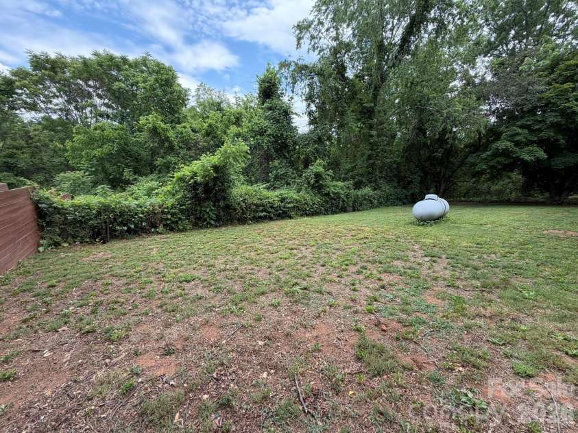 41 Oak Hill Drive, Asheville, NC 28806.  MLS# CAR4384194, YatesRealty ID 51135. Back yard goes into wooded area approximately 90 ft.