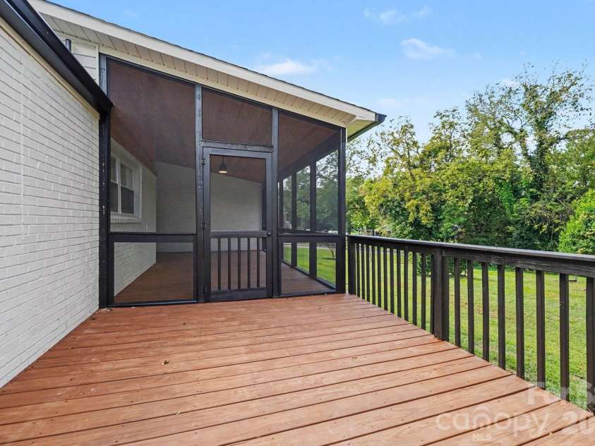 433 Main Street, Mocksville, NC 27028.  MLS# CAR4423506, YatesRealty ID 51141. Screened porch and grilling deck.