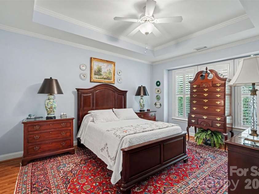 2604 Bellasera Way, Matthews, NC 28105.  MLS# CAR4425096, YatesRealty ID 51142. Main level primary bedroom