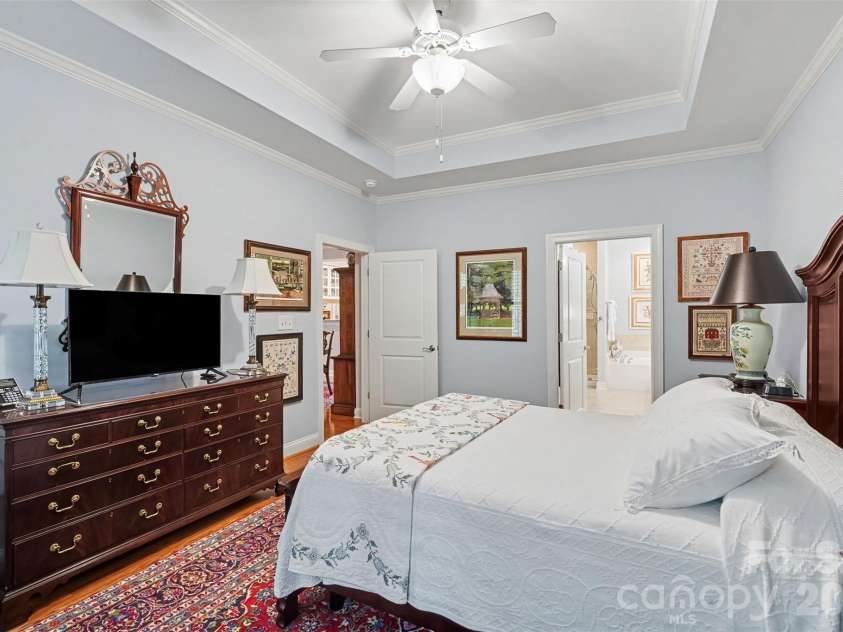2604 Bellasera Way, Matthews, NC 28105.  MLS# CAR4425096, YatesRealty ID 51142. Main level primary bedroom