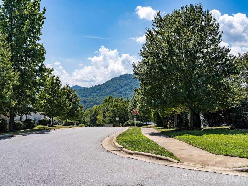 896 West Pointe Drive, Asheville, NC 28806.  MLS# CAR4420183, YatesRealty ID 51145. Beautiful setting w/ sidewalks throughout the development.