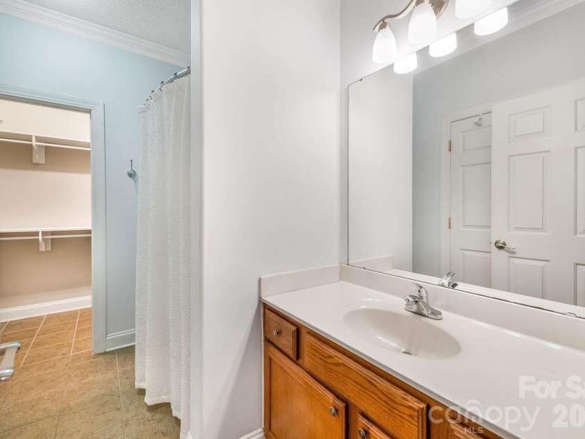 896 West Pointe Drive, Asheville, NC 28806.  MLS# CAR4420183, YatesRealty ID 51145. Primary ensuite with a walk-in closet.