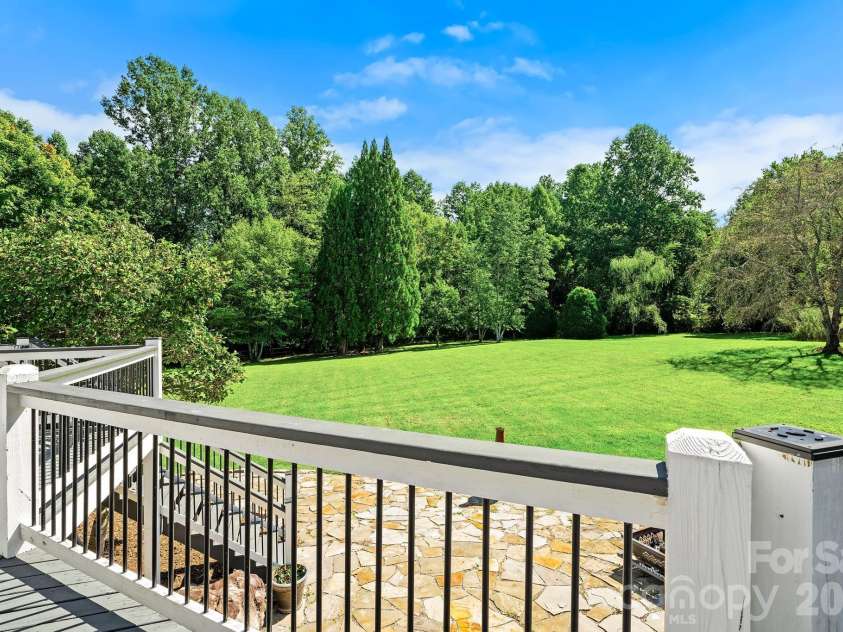 187 Duncan Creek Road, Fletcher, NC 28732.  MLS# CAR4424773, YatesRealty ID 51157. Deck view across the expansive lawn