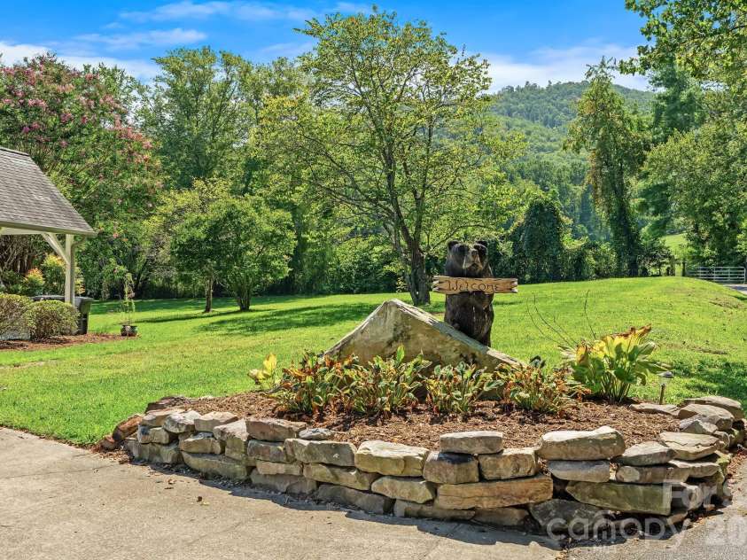 187 Duncan Creek Road, Fletcher, NC 28732.  MLS# CAR4424773, YatesRealty ID 51157. Decorative entry garden