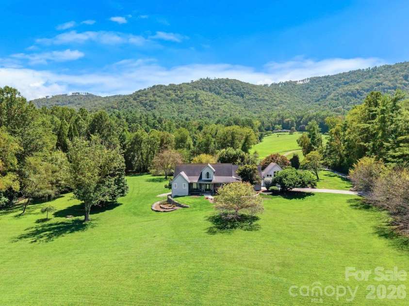 187 Duncan Creek Road, Fletcher, NC 28732.  MLS# CAR4424773, YatesRealty ID 51157. Expansive level grounds with a beautiful mountain backdrop