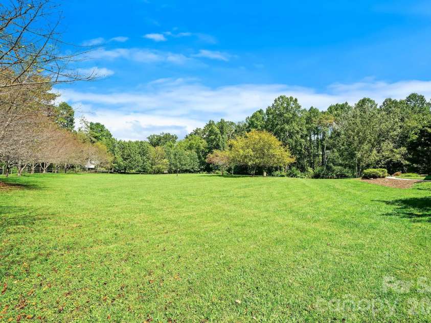 187 Duncan Creek Road, Fletcher, NC 28732.  MLS# CAR4424773, YatesRealty ID 51157. Expansive level lawn