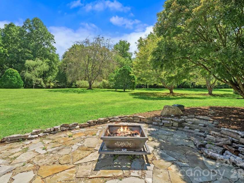 187 Duncan Creek Road, Fletcher, NC 28732.  MLS# CAR4424773, YatesRealty ID 51157. Fire pit and outdoor gathering area