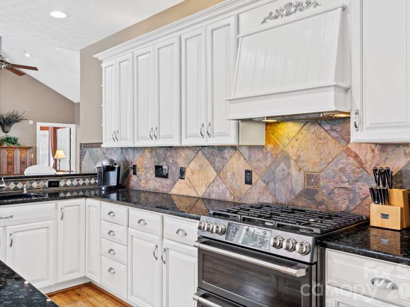 187 Duncan Creek Road, Fletcher, NC 28732.  MLS# CAR4424773, YatesRealty ID 51157. Gas range with a tiled backsplash