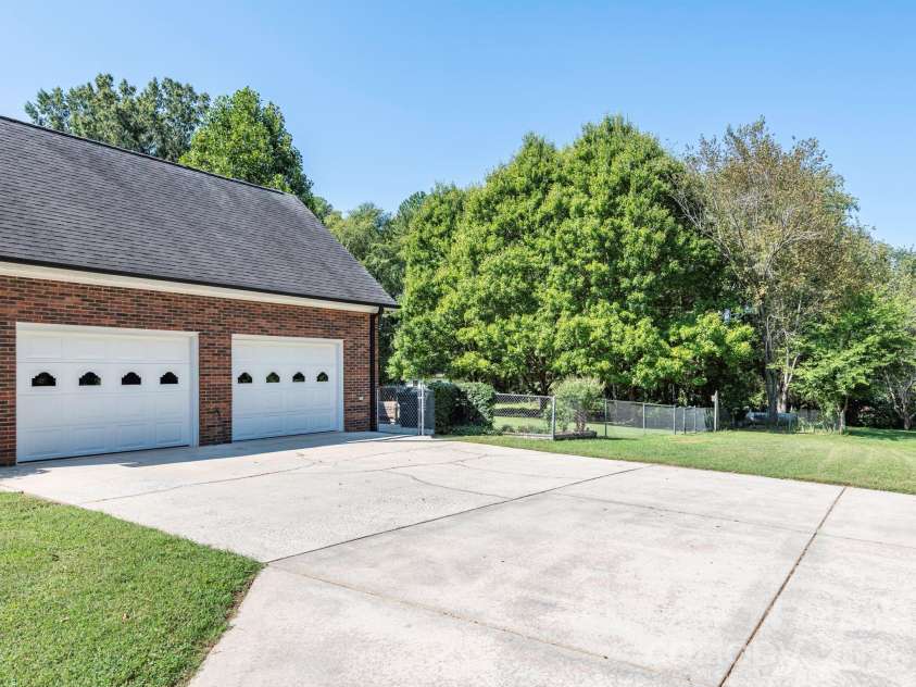 2434 Plantation Road, Concord, NC 28027.  MLS# CAR4425292, YatesRealty ID 51163. Oversized driveway next to garage