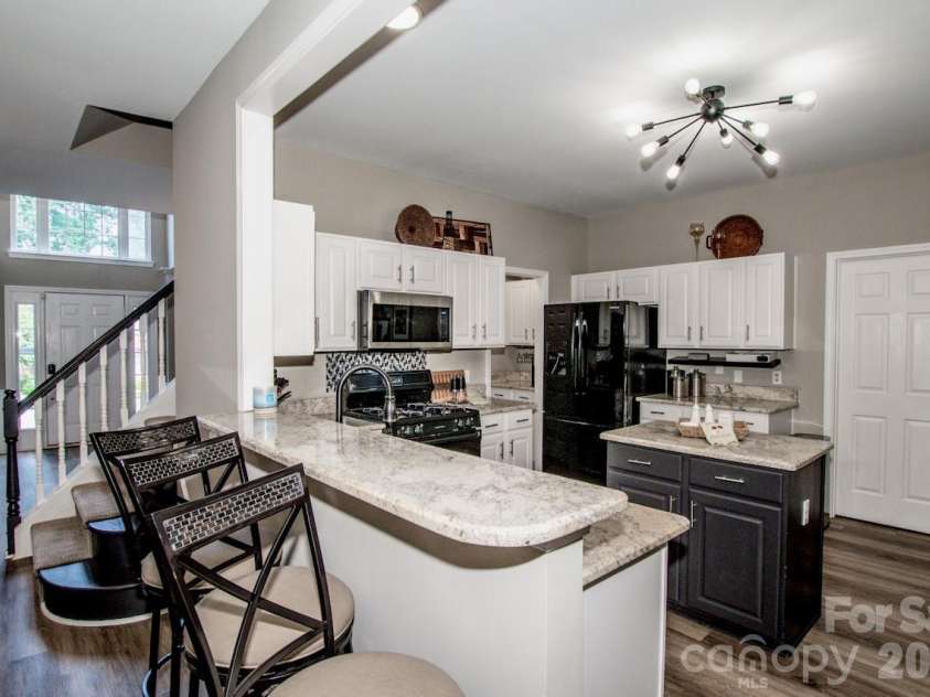 111 Comata Road, Mooresville, NC 28117.  MLS# CAR4423905, YatesRealty ID 51181. Breakfast bar/Kitchen view 1