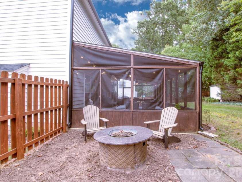 111 Comata Road, Mooresville, NC 28117.  MLS# CAR4423905, YatesRealty ID 51181. Fire pit area in fenced backyard