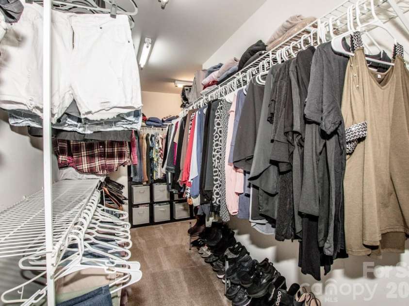 111 Comata Road, Mooresville, NC 28117.  MLS# CAR4423905, YatesRealty ID 51181. Oversize L shaped primary closet with attic access