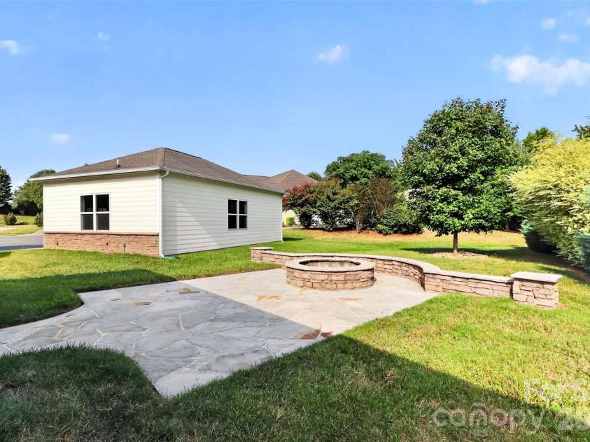 10605 Coronet Court, Harrisburg, NC 28075.  MLS# CAR4425438, YatesRealty ID 51184. Gas feed fire pit