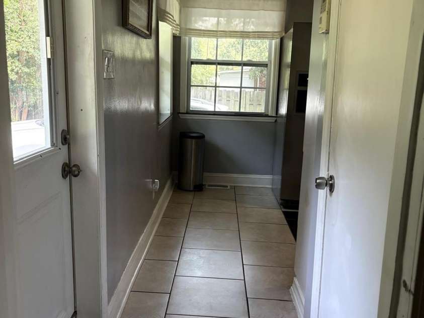818 Hillcrest Avenue, Gastonia, NC 28052.  MLS# CAR4424650, YatesRealty ID 51192. THIRD ROOM HALLWAY TO KITCHEN AND BACKYARD