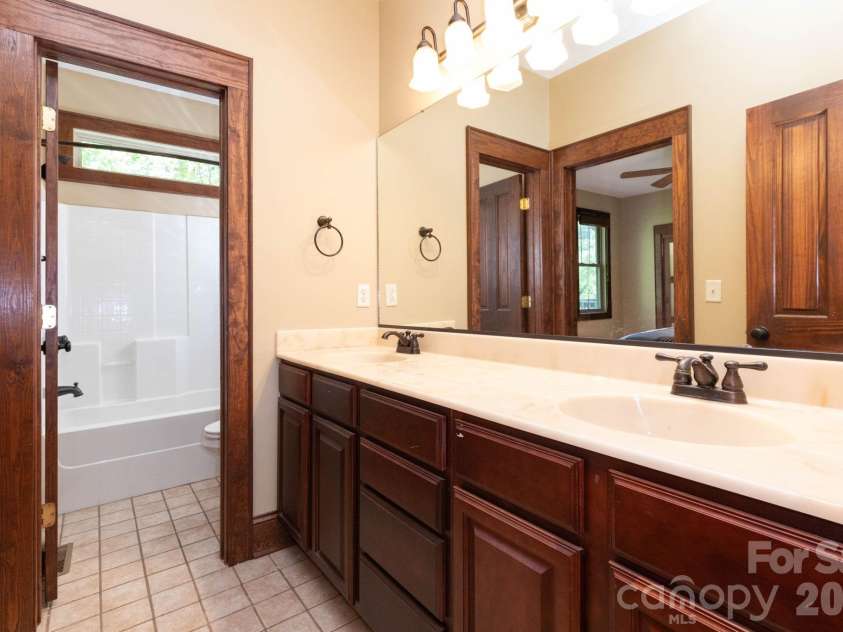 5 Meadowbrook Lane, Weaverville, NC 28787.  MLS# CAR4425213, YatesRealty ID 51199. Jack and Jill Bathroom