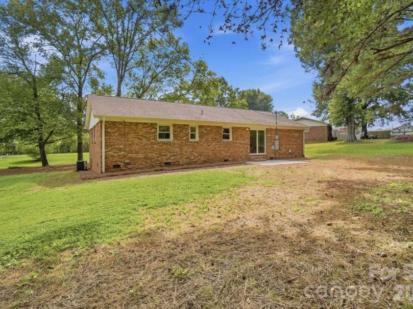117 Boundary Road, Oakboro, NC 28129.  MLS# CAR4424286, YatesRealty ID 51204. Oversized yard with fresh patio for entertaining
