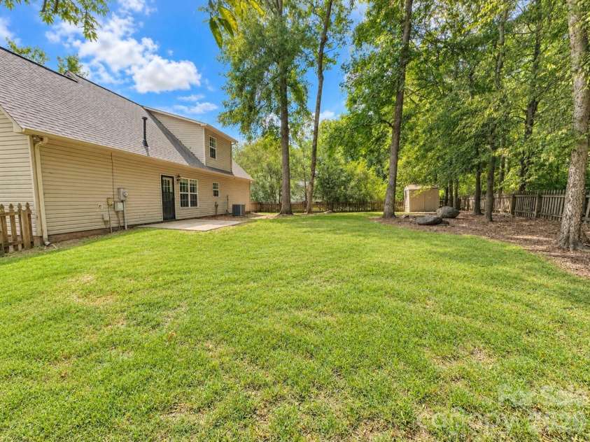 4075 Zebulon Avenue, Concord, NC 28027.  MLS# CAR4425234, YatesRealty ID 51208. Large Backyard