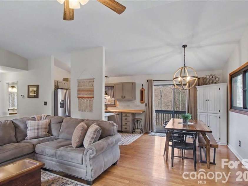 30 Whippoorwill Drive, Weaverville, NC 28787.  MLS# CAR4425568, YatesRealty ID 51211. Living room flows nicely into the dining area and kitchen