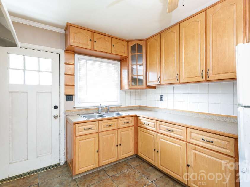 1017 Woodland Drive, Gastonia, NC 28054.  MLS# CAR4425603, YatesRealty ID 51213. Kitchen with back entrance