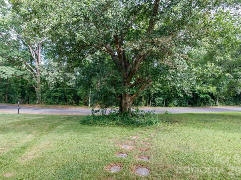 1017 Woodland Drive, Gastonia, NC 28054.  MLS# CAR4425603, YatesRealty ID 51213. Mature trees