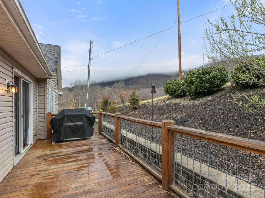 35 Donaldson Place, Waynesville, NC 28786.  MLS# CAR4239581, YatesRealty ID 5122. Back deck.