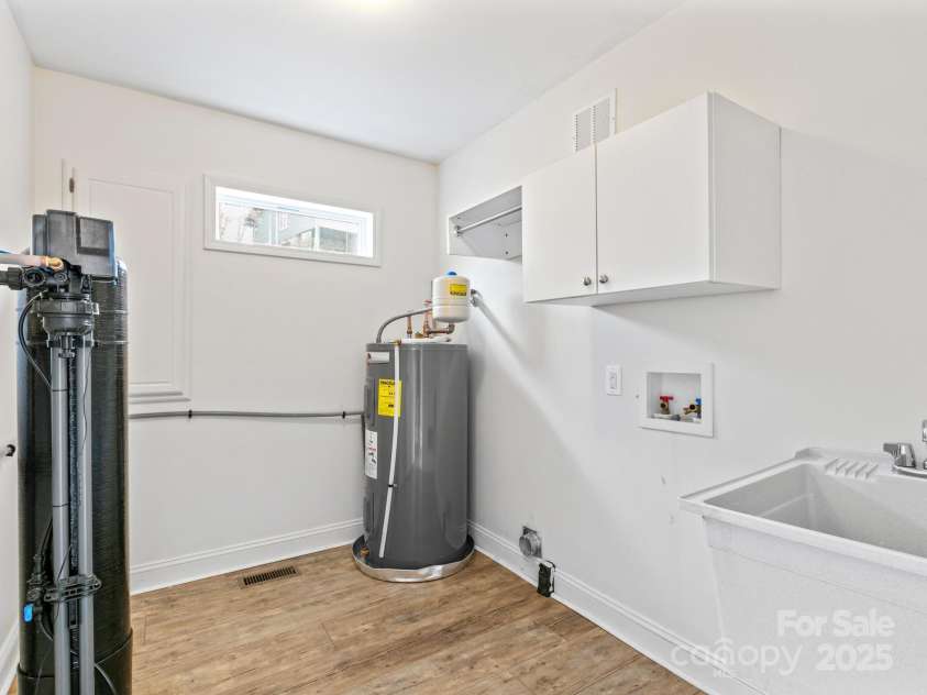 35 Donaldson Place, Waynesville, NC 28786.  MLS# CAR4239581, YatesRealty ID 5122. Dedicated laundry room complete with utility sink.