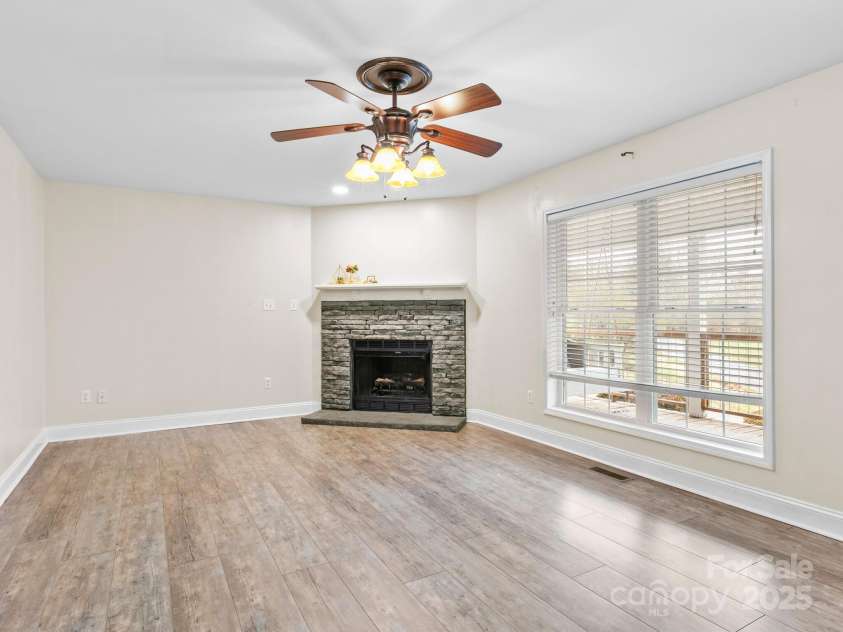 35 Donaldson Place, Waynesville, NC 28786.  MLS# CAR4239581, YatesRealty ID 5122. Spacious living room with gas log fireplace.