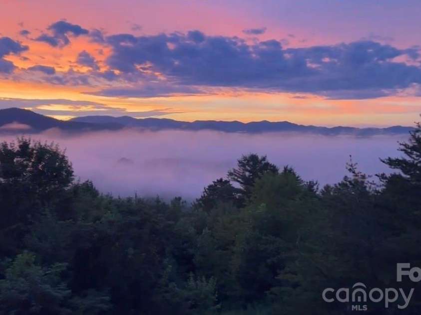 101 Balsamwood Road, Leicester, NC 28748.  MLS# CAR4425573, YatesRealty ID 51222. Sunset