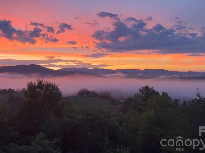 101 Balsamwood Road, Leicester, NC 28748.  MLS# CAR4425573, YatesRealty ID 51222. Sunset View