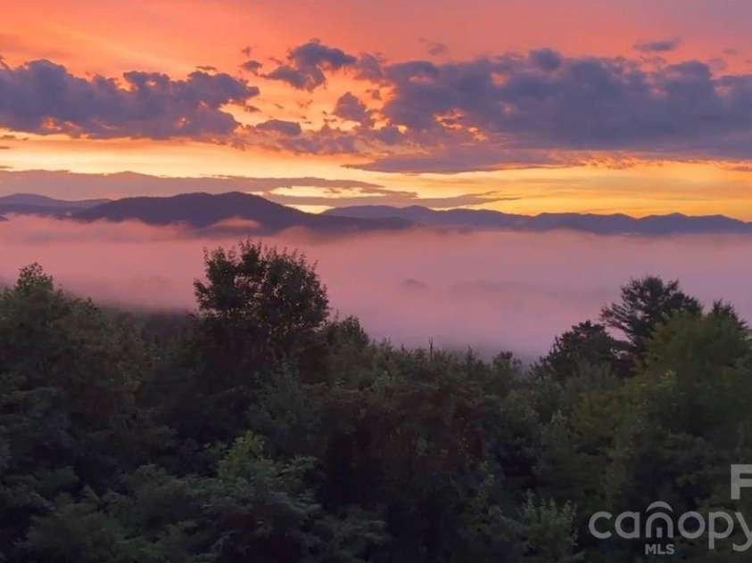 101 Balsamwood Road, Leicester, NC 28748.  MLS# CAR4425573, YatesRealty ID 51222. Sunset view
