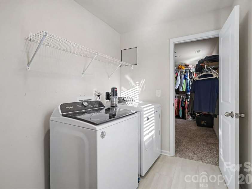 1623 Baymont Court, Stanley, NC 28164.  MLS# CAR4424072, YatesRealty ID 51244. A dedicated laundry room with extra storage and direct access from the Primary bedroom closet.
