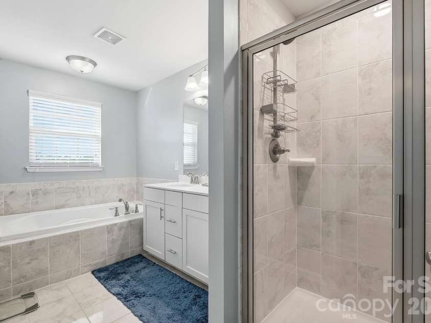 3224 Morgan Clark Road, Charlotte, NC 28208.  MLS# CAR4423182, YatesRealty ID 51257. Primary Bath with walk-in shower and soaker tub
