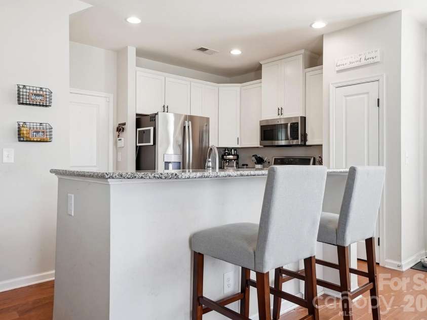 3224 Morgan Clark Road, Charlotte, NC 28208.  MLS# CAR4423182, YatesRealty ID 51257. Seating at the island