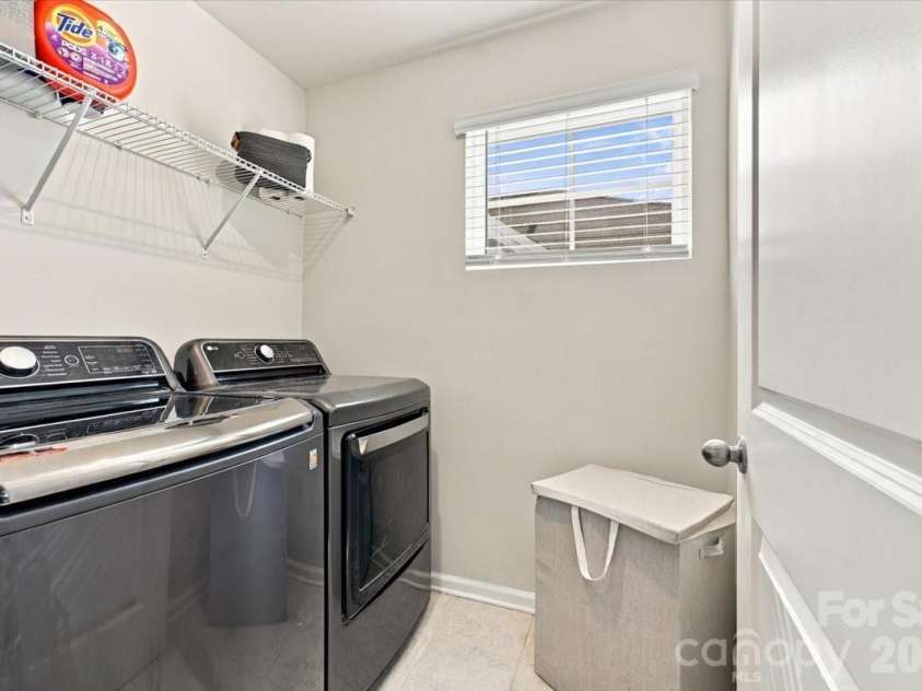 8036 Overmeadow Lane, Charlotte, NC 28269.  MLS# CAR4419889, YatesRealty ID 51259. Laundry on second floor