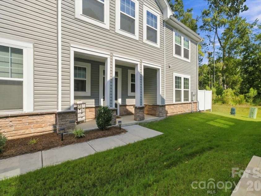 8036 Overmeadow Lane, Charlotte, NC 28269.  MLS# CAR4419889, YatesRealty ID 51259. Side entry to home