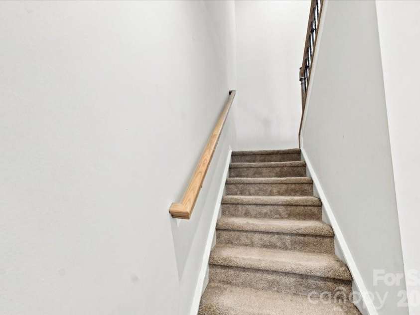 8036 Overmeadow Lane, Charlotte, NC 28269.  MLS# CAR4419889, YatesRealty ID 51259. Stairs to second floor