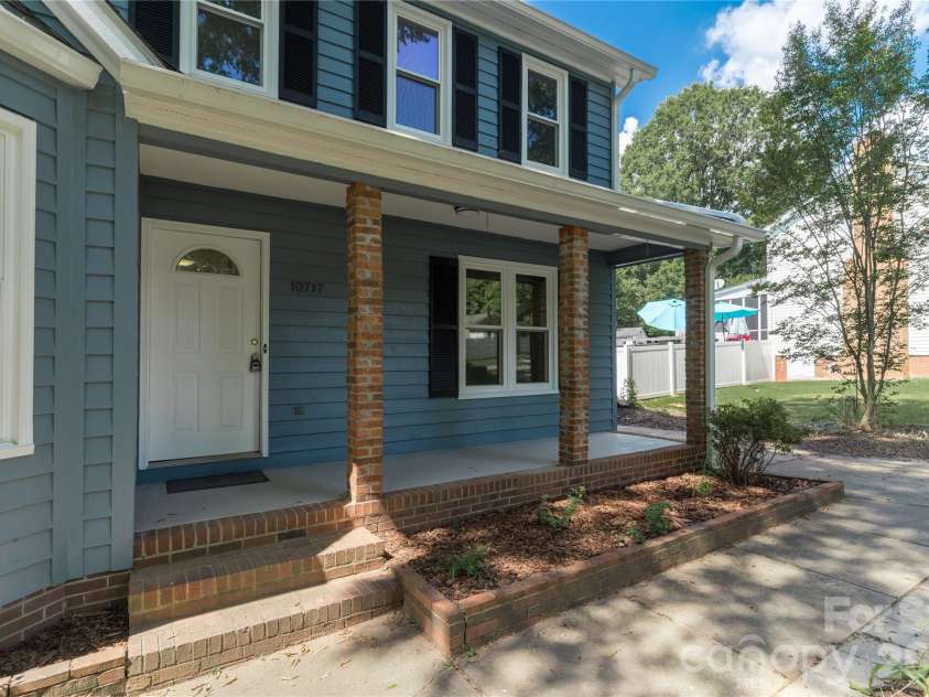 10717 Danesway Lane, Cornelius, NC 28031.  MLS# CAR4418933, YatesRealty ID 51266. Covered front porch