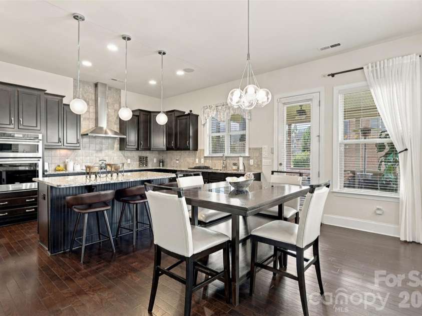 131 Reserve Lane, Indian Land, SC 29707.  MLS# CAR4417292, YatesRealty ID 51276. Kitchen, exit on to screened in porch