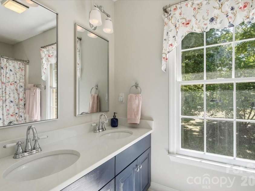 5138 Panhandle Circle, Matthews, NC 28104.  MLS# CAR4407389, YatesRealty ID 51282. Hall Bath with Double Vanity5138 Panhandle CirWeddington, NC 28104