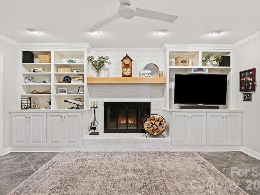 5138 Panhandle Circle, Matthews, NC 28104.  MLS# CAR4407389, YatesRealty ID 51282. Keeping Room Fireplace and Built Ins 5138 Panhandle CirWeddington, NC 28104