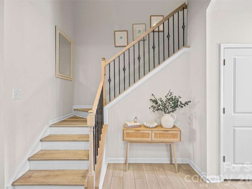 7035 Everly Commons Lane, Tega Cay, SC 29708.  MLS# CAR4415741, YatesRealty ID 51319. Oak Staircase with Iron Baulsters