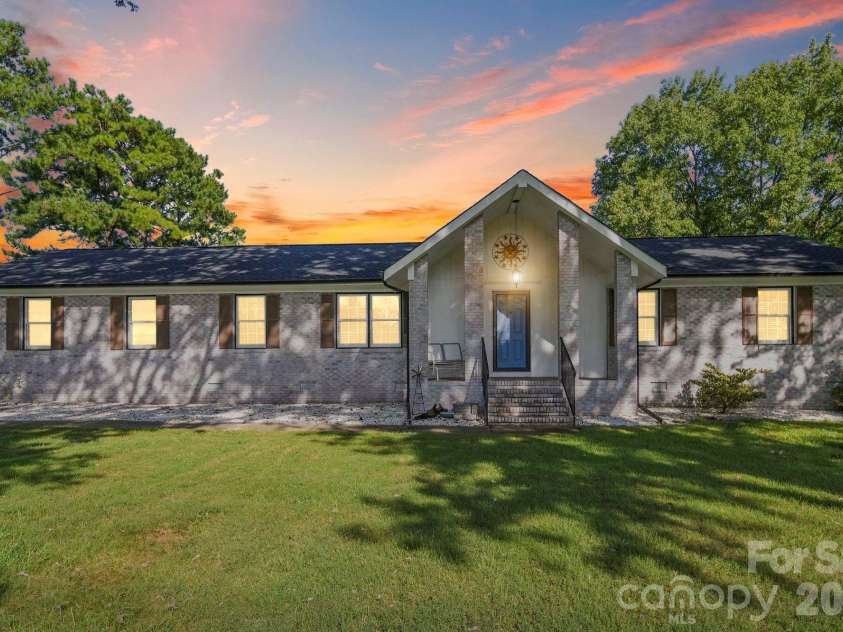 4410 Coddle Creek Drive, Concord, NC 28027.  MLS# CAR4422400, YatesRealty ID 51340. Digitally enhanced lighting and sunset