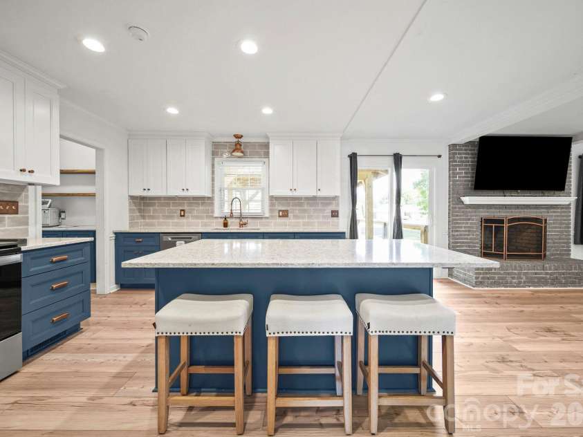 4410 Coddle Creek Drive, Concord, NC 28027.  MLS# CAR4422400, YatesRealty ID 51340. Island big enough for 6 stools (3 on each side)