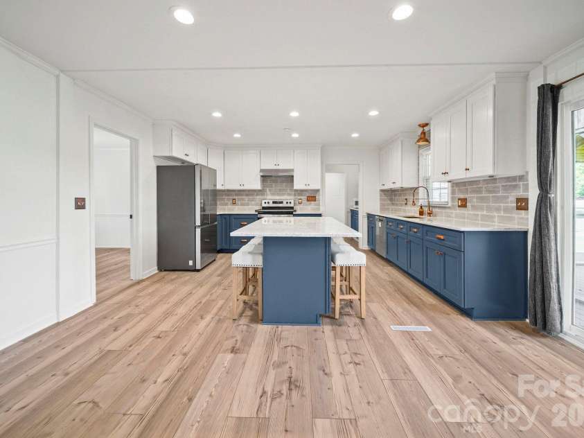 4410 Coddle Creek Drive, Concord, NC 28027.  MLS# CAR4422400, YatesRealty ID 51340. Upgraded kitchen with copper accents