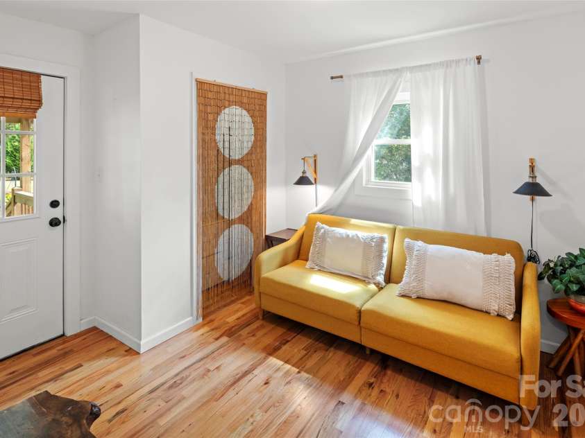 28 Long Cove Road, Candler, NC 28715.  MLS# CAR4425807, YatesRealty ID 51360. Bedroom #2 with exit to covered back deck