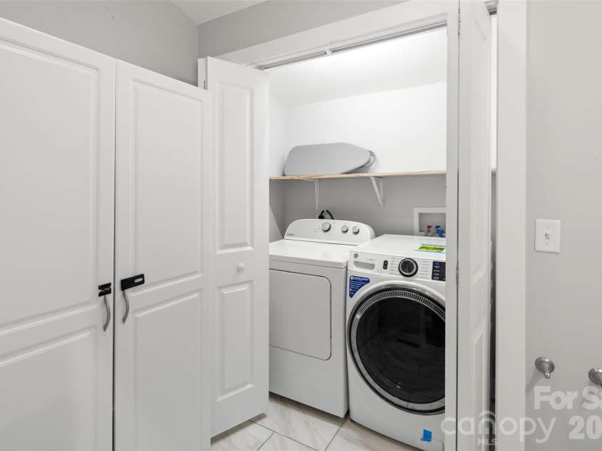28 Long Cove Road, Candler, NC 28715.  MLS# CAR4425807, YatesRealty ID 51360. Laundry and half bath