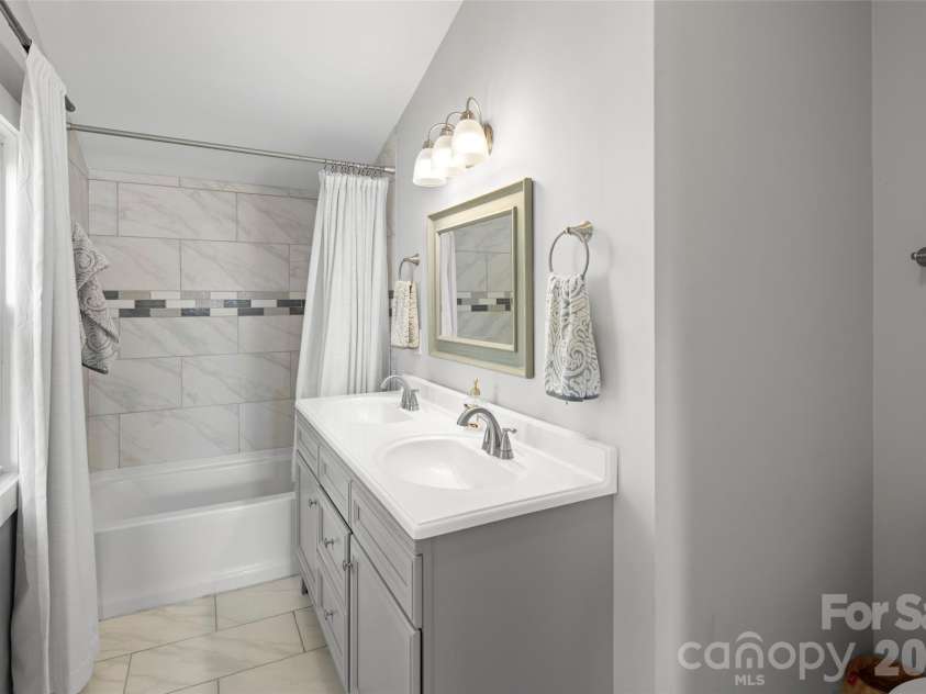 28 Long Cove Road, Candler, NC 28715.  MLS# CAR4425807, YatesRealty ID 51360. Primary Bath