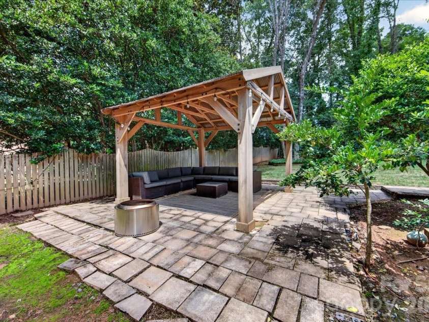 4509 Mullens Ford Road, Charlotte, NC 28226.  MLS# CAR4425762, YatesRealty ID 51379. Covered Outdoor Seating Area