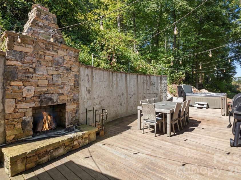 349 View Rock Lane, Hendersonville, NC 28791.  MLS# CAR4422786, YatesRealty ID 51384. Private entertaining deck with wood burning fireplace