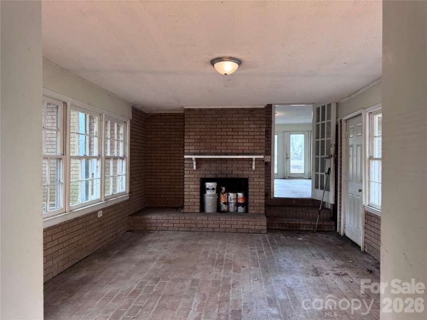 1713 White Store Road, Monroe, NC 28112.  MLS# CAR4425609, YatesRealty ID 51387. Enclosed Porch with Cozy Fireplace